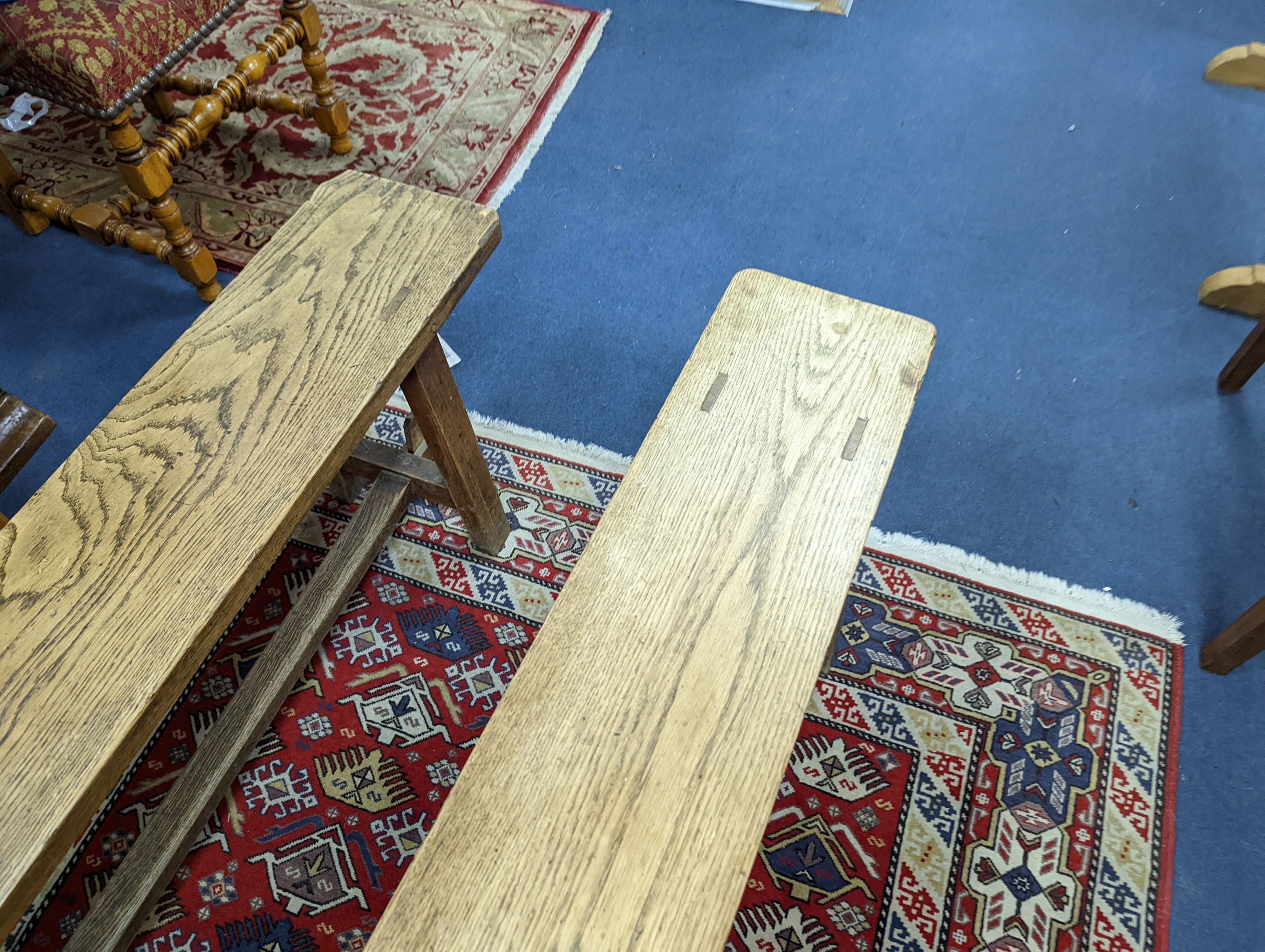 A pair of 19th century French provincial oak bench seats, length 170cm, depth 22cm, height 44cm